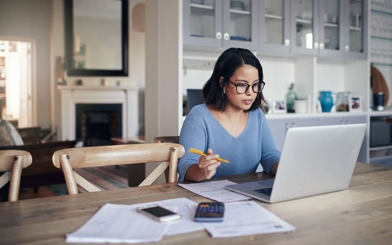 Woman looking through her credit score and report