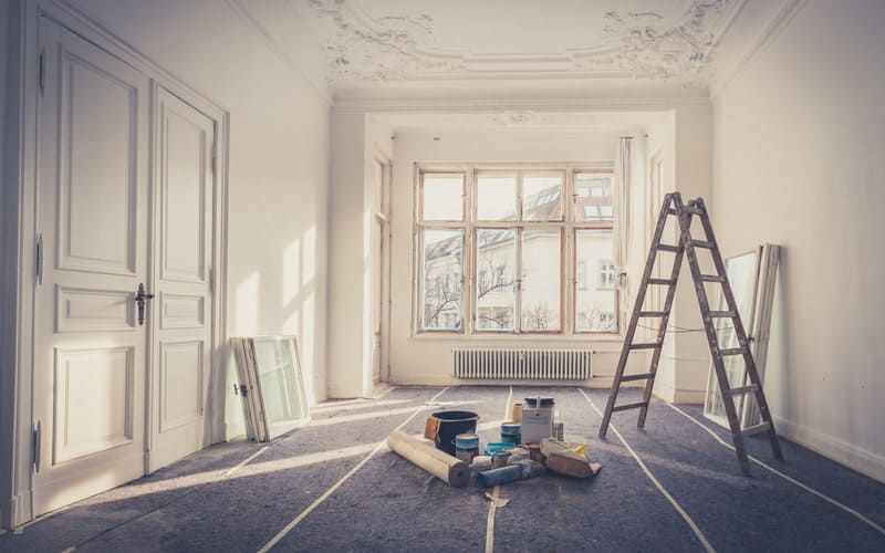 Ladder in a room that needs a renovation