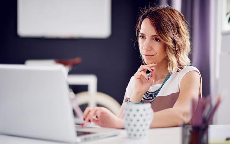 Woman checking if she qualifies for second mortgage